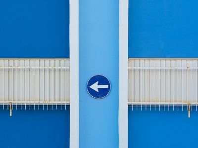 Sharp metallic arrows pointing upwards in a dark space