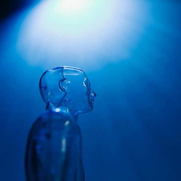 Stylized blue abstract mountain peaks symbolizing progress and growth